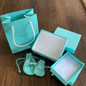 Variety of Tiffany’s boxes, pouches and a bag.